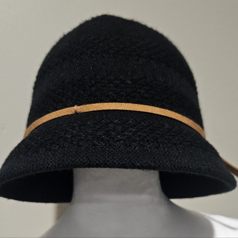 Black bucket hat with tan leather strap